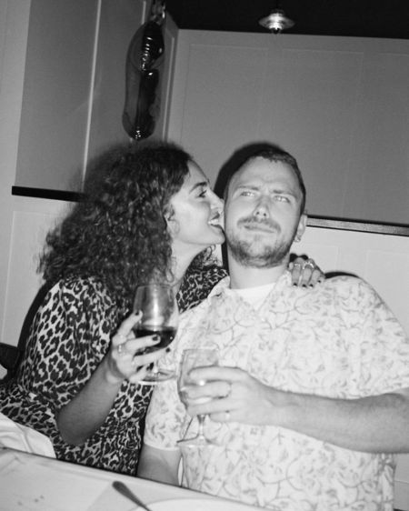 Anna kissing on Jim’s cheek on his birthday.